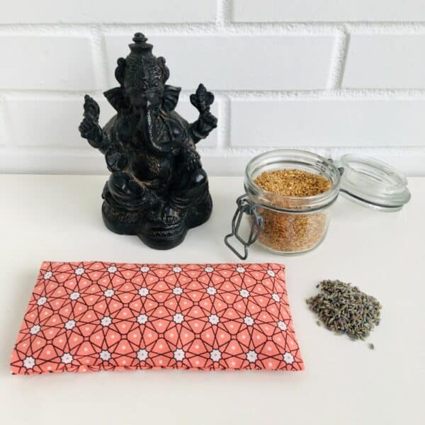 Coussin relaxation yeux étoiles corail